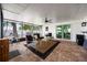 Covered patio with brick floor, comfortable seating, and large windows for natural light at 4124 Herrick Ln, Sarasota, FL 34241