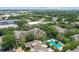 Aerial view of apartments with a community pool and mature trees at 4207 S Dale Mabry Hwy # 2105, Tampa, FL 33611