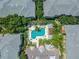 Overhead view of apartments surrounding a pool with lounge chairs and tables at 4207 S Dale Mabry Hwy # 2105, Tampa, FL 33611