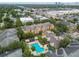 Aerial view of apartments with pool, lounge chairs and cabanas at 4207 S Dale Mabry Hwy # 2105, Tampa, FL 33611