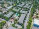 Aerial view of apartments and community pool surrounded by mature trees at 4207 S Dale Mabry Hwy # 2105, Tampa, FL 33611