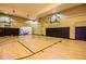 Spacious indoor basketball court featuring hardwood floors and padded walls at 4207 S Dale Mabry Hwy # 2105, Tampa, FL 33611