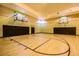 Indoor basketball court with hoops and padded walls at 4207 S Dale Mabry Hwy # 2105, Tampa, FL 33611