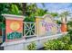 Grand Key Condominiums entrance sign surrounded by lush landscaping and tropical palm trees on a sunny day at 4207 S Dale Mabry Hwy # 2105, Tampa, FL 33611