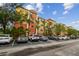A colorful three story building with reserved parking and palm trees at 4207 S Dale Mabry Hwy # 2105, Tampa, FL 33611