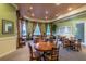 Community game room with round tables, comfortable chairs, and large windows for natural light at 4207 S Dale Mabry Hwy # 2105, Tampa, FL 33611