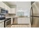 Well-equipped kitchen boasts stainless steel appliances, granite countertops and modern cabinetry at 4207 S Dale Mabry Hwy # 2105, Tampa, FL 33611