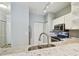 Kitchen featuring stainless steel appliances, granite countertops, and ample cabinet space; pantry closet, fridge and washer/dryer visible at 4207 S Dale Mabry Hwy # 2105, Tampa, FL 33611