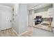 Modern kitchen featuring stainless steel appliances, granite countertops, white cabinets and views to entry and pantry/laundry area at 4207 S Dale Mabry Hwy # 2105, Tampa, FL 33611