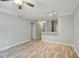 Bright living room featuring hardwood floors, soft blue paint, and modern lighting for a serene atmosphere at 4207 S Dale Mabry Hwy # 2105, Tampa, FL 33611