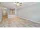 Spacious living area with wood-look floors, access to the kitchen, and ample natural light at 4207 S Dale Mabry Hwy # 2105, Tampa, FL 33611