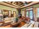 Inviting community lounge with wicker furniture, tropical decor, and ample space for socializing at 4207 S Dale Mabry Hwy # 2105, Tampa, FL 33611
