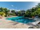 Serene community pool surrounded by lush tropical foliage, offering a relaxing retreat for residents at 4207 S Dale Mabry Hwy # 2105, Tampa, FL 33611