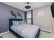 Cozy bedroom featuring a large bed, stylish decor, and ample natural light at 4212 W La Salle St, Tampa, FL 33607