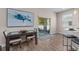 Cozy dining area with a dark wood table, patio view, and stylish artwork at 4212 W La Salle St, Tampa, FL 33607
