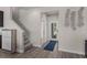 Inviting foyer with wood-look flooring and staircase leading to the upper level of the home at 4212 W La Salle St, Tampa, FL 33607