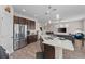 Modern kitchen featuring an island, stainless steel appliances, and an open layout into the living area at 4212 W La Salle St, Tampa, FL 33607