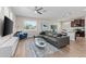 Spacious living room with wood floors, contemporary decor, and an open layout that flows into the kitchen at 4212 W La Salle St, Tampa, FL 33607