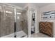 Walk-in shower is enclosed with a glass door and ceramic tile surround at 4212 W La Salle St, Tampa, FL 33607