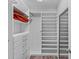 Well-organized walk-in closet featuring built-in drawers, shelves, and hanging space at 4212 W La Salle St, Tampa, FL 33607