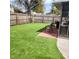 Well-maintained backyard with artificial turf, brick patio, and screened-in porch at 5119 Hector Ct, Tampa, FL 33624