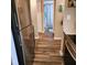Hallway showing stainless steel refrigerator and view of bathroom at 5119 Hector Ct, Tampa, FL 33624