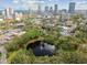 Aerial shot featuring a scenic park and pond with downtown skyline in the background at 535 6Th N St, St Petersburg, FL 33701