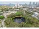Aerial shot featuring a scenic park and pond with downtown skyline in the background at 535 6Th N St, St Petersburg, FL 33701