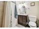 Cozy bathroom features shower with curtain and updated fixtures at 535 6Th N St, St Petersburg, FL 33701