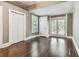 A bright bedroom with hardwood floors, closet, backyard access, and natural light at 535 6Th N St, St Petersburg, FL 33701