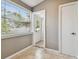 Entryway features tile flooring, a window with blinds, and views of the neighborhood at 535 6Th N St, St Petersburg, FL 33701