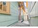 Charming exterior entrance with painted siding, steps, and a purple door at 535 6Th N St, St Petersburg, FL 33701