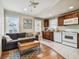 Cozy open-concept living room and kitchen featuring stainless steel appliances and comfortable seating at 535 6Th N St, St Petersburg, FL 33701