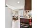 Cozy living area featuring a refrigerator and view to the living room area at 535 6Th N St, St Petersburg, FL 33701