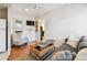 Comfortable living room featuring a hardwood floor, sofa, and a TV at 535 6Th N St, St Petersburg, FL 33701