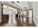 Spacious living room with dark hardwood floors, coffered ceilings, a fireplace, and an open layout at 535 6Th N St, St Petersburg, FL 33701