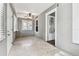 Bright sun room featuring neutral walls, tiled flooring, and plenty of natural light from multiple windows at 535 6Th N St, St Petersburg, FL 33701