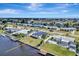 Scenic overhead view of a waterfront property, nestled in a coastal community with boating access and serene waterways at 551 Lindley Ter, Port Charlotte, FL 33952