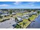 Waterfront neighborhood featuring canal access, lush lawns, and sunny skies at 551 Lindley Ter, Port Charlotte, FL 33952