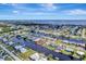 Waterfront property with canal access, seawall, well-manicured lawn and mature landscaping, and nearby water access at 551 Lindley Ter, Port Charlotte, FL 33952