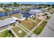 Waterfront home features mature landscaping, fenced yard, seawall, and canal access, perfect for boating enthusiasts at 551 Lindley Ter, Port Charlotte, FL 33952
