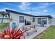 Outdoor living space featuring patio with grill and picnic table, perfect for entertaining and enjoying outdoor meals at 551 Lindley Ter, Port Charlotte, FL 33952