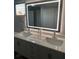 Bright bathroom vanity with dual sinks, framed mirror, and soft close drawers at 551 Lindley Ter, Port Charlotte, FL 33952