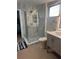 Updated bathroom featuring a glass shower enclosure and modern vanity at 551 Lindley Ter, Port Charlotte, FL 33952
