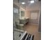 Updated bathroom featuring a glass shower enclosure, illuminated mirror and updated vanity at 551 Lindley Ter, Port Charlotte, FL 33952