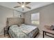 Comfortable bedroom featuring a ceiling fan and a serene view from the window at 551 Lindley Ter, Port Charlotte, FL 33952