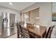 Charming dining area featuring a rustic wooden table, stainless steel appliances, and natural light at 551 Lindley Ter, Port Charlotte, FL 33952