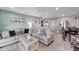 Bright living room with comfortable seating, an open floor plan, and a seamless flow to the dining area at 551 Lindley Ter, Port Charlotte, FL 33952