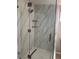 Bathroom featuring a modern glass shower enclosure with upgraded fixtures at 551 Lindley Ter, Port Charlotte, FL 33952
