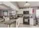 Bright kitchen with stainless steel appliances, granite countertops, and ample storage space at 5826 Taywood Dr, Tampa, FL 33624